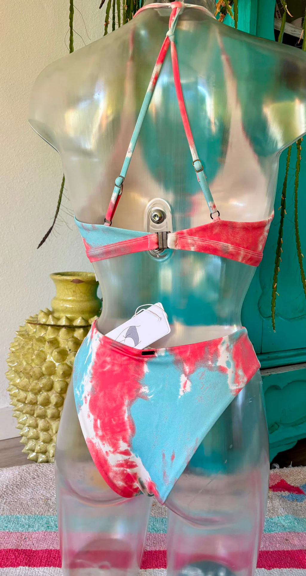Coral and aqua tie-dye halter bikini with adjustable neck strap and high-rise bottoms, back view