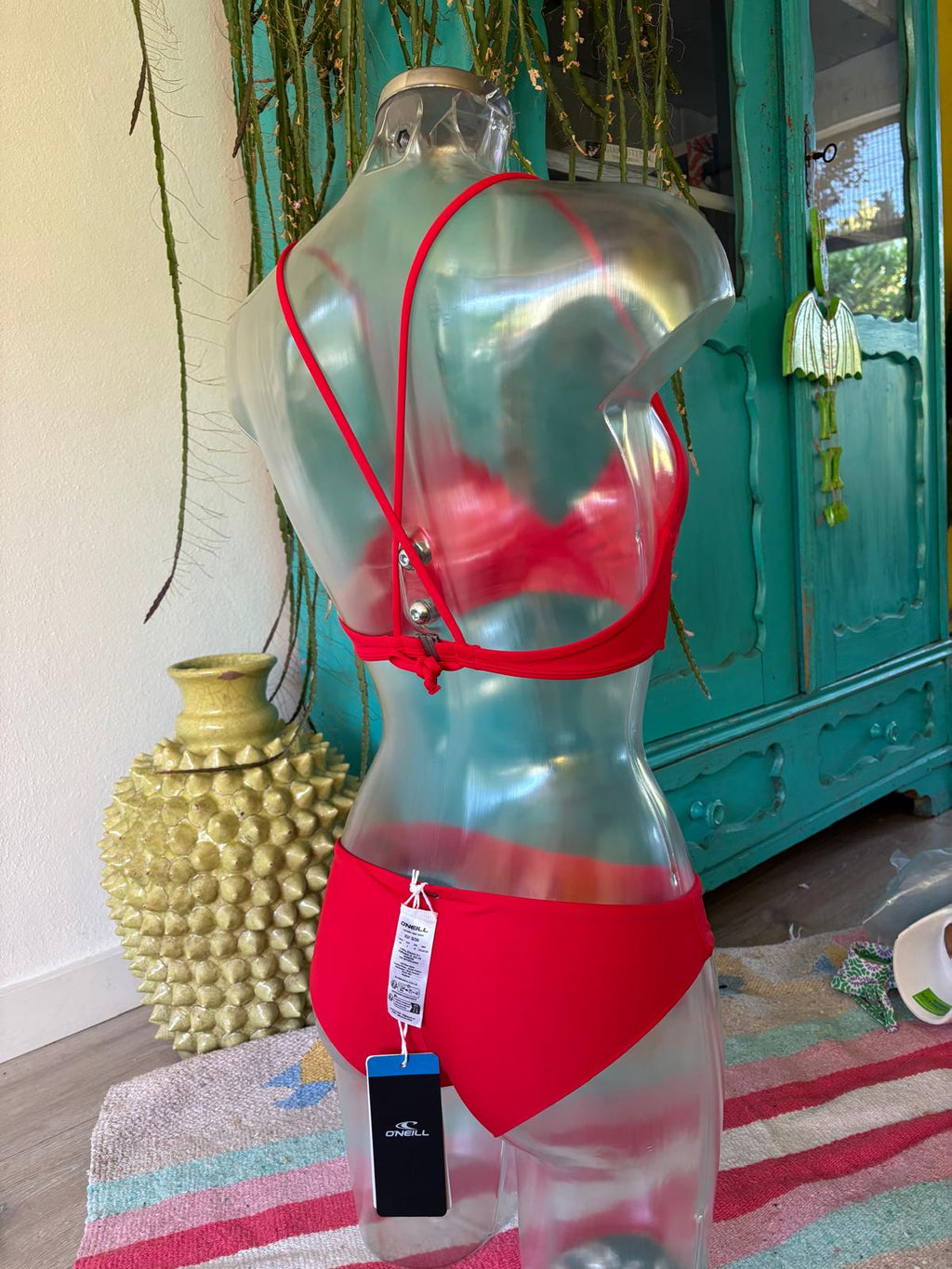 O’Neill red bikini with cross-back straps, back fastening and matching bottoms, rear view